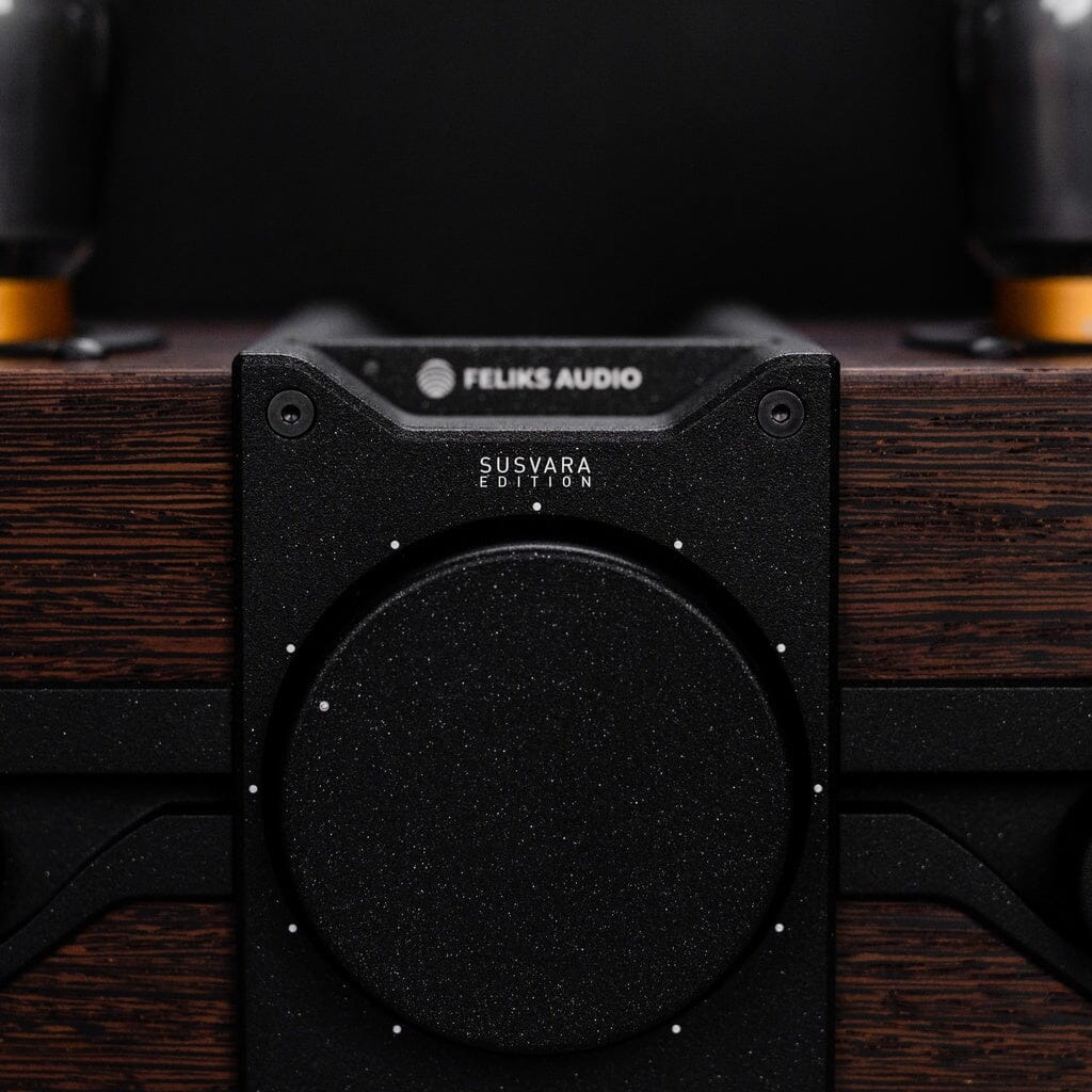 Close-up of the Feliks Audio Envy Susvara Edition by Feliks Audio, featuring a striking black "SUSVARA EDITION" dial, wood grain finish, and visible vacuum tubes—an ideal headphone amplifier for HIFIMAN Susvara fans.