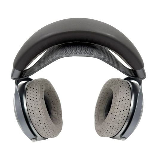 The Capra Comfort Strap for Focal Headphones - Large by Capra Audio features gray, perforated over-ear cushions and a black padded comfort headband, displayed from the front against a white background.