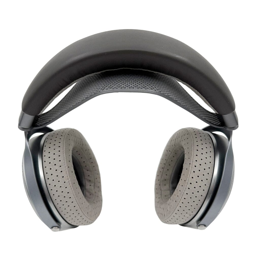 The Focal Clear Headphones + Capra Strap Comfort Bundle by Focal, featuring large gray cushioned ear pads and a black padded headband, is shown from above on a white background.