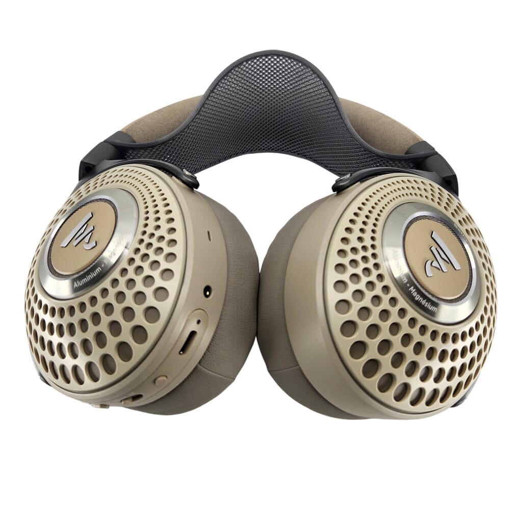 The Capra Audio Capra Comfort Strap for Focal Headphones - Small is shown in beige with perforated ear cups, a padded headband, headphone comfort strap for support, visible outer side, and metallic logo detailing.