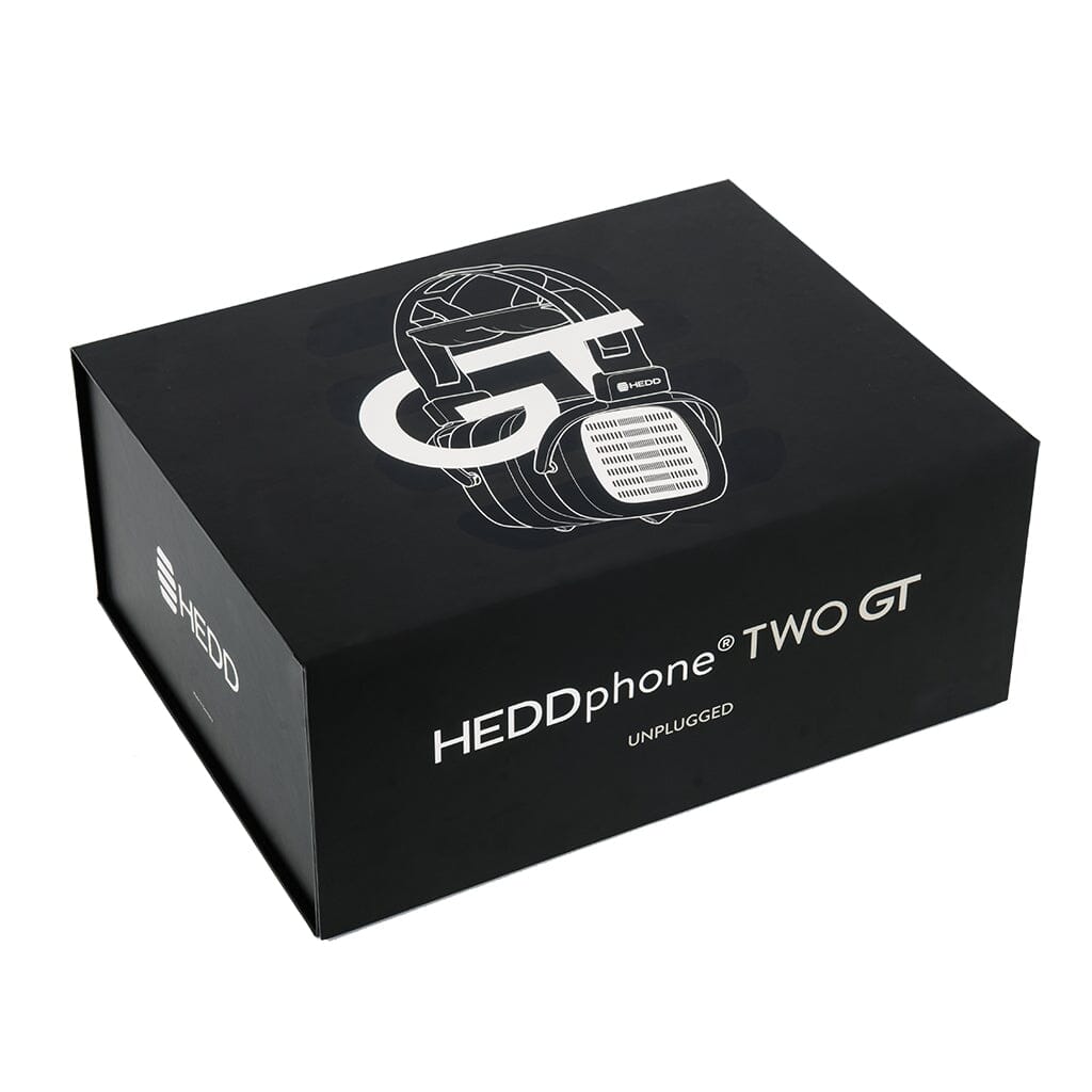 A black box displays "HEDDphone TWO GT UNPLUGGED," a line drawing of headphones, and the HEDD Audio brand, highlighting the HEDD Audio HEDDphone TWO GT UNPLUGGED Edition with AMT driver and warmer tuning.