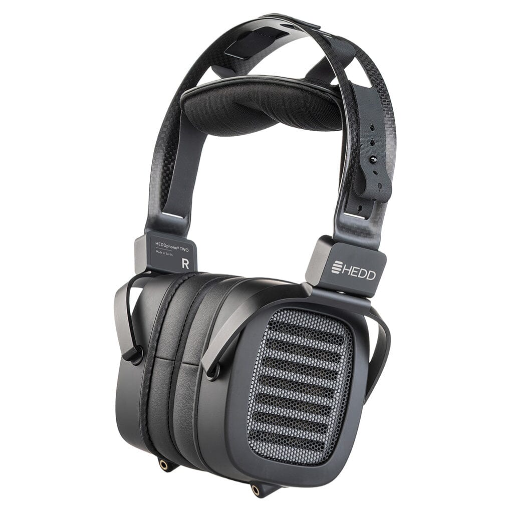The HEDD Audio HEDDphone TWO UNPLUGGED Edition are black over-ear reference headphones with large rectangular cups, mesh grilles highlighting the AMT driver, a padded headband, and "HEDD Audio" branding on the side.