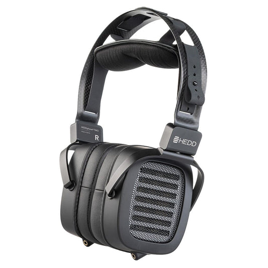 The HEDD Audio HEDDphone TWO UNPLUGGED Edition are black over-ear reference headphones with large rectangular cups, mesh grilles highlighting the AMT driver, a padded headband, and "HEDD Audio" branding on the side.