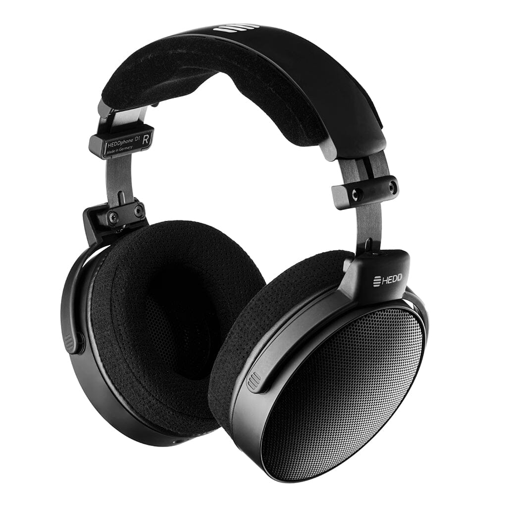 The HEDD Audio HEDDphone D1 headphones, shown in black with cushioned ear pads and a padded headband against a white background, feature a sleek design, visible HEDD Audio branding, and Thin-Ply Carbon Diaphragm technology.