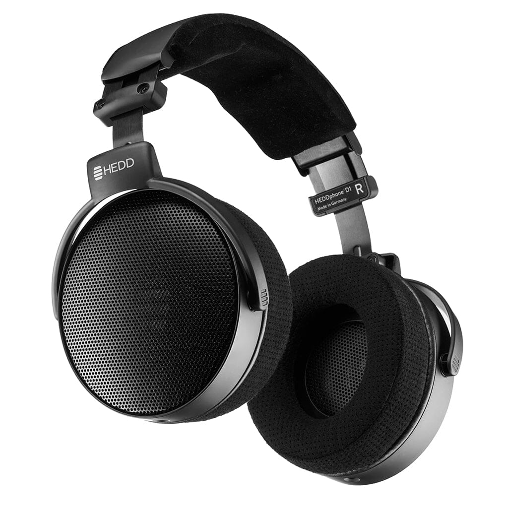 A pair of black HEDD Audio HEDDphone D1 over-ear headphones with cushioned ear pads, padded headband, mesh-design ear cups, Thin-Ply Carbon Diaphragm, and "L" and "R" labels, displayed on a white background.