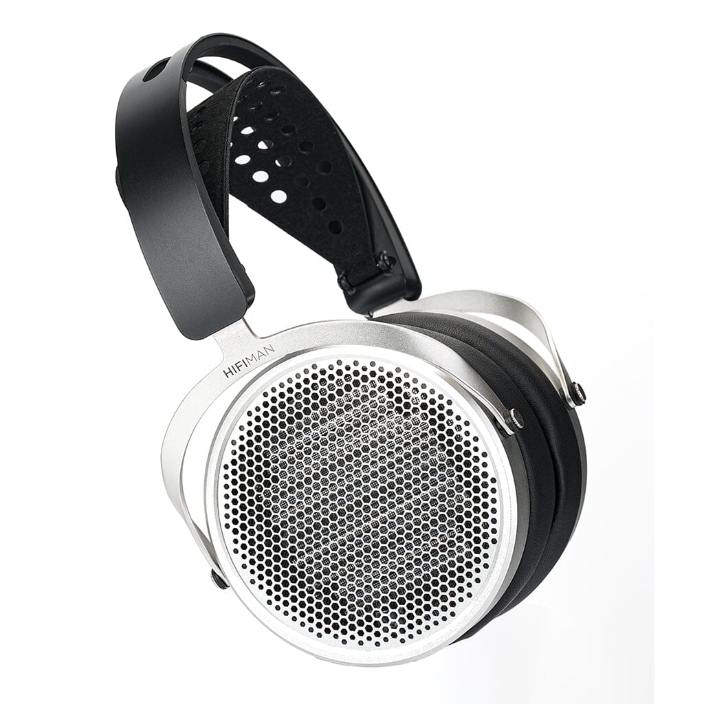The Hifiman HE600 Headphones by Hifiman feature large, round silver ear cups with mesh grilles, plush black pads, and an adjustable perforated headband—ideal for use with headphone amplifiers.