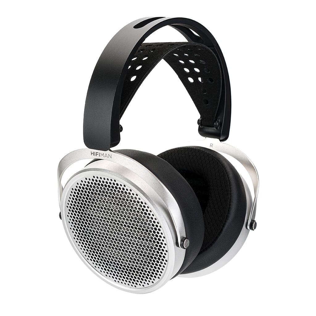 The Hifiman HE600 Headphones by Hifiman are large, over-ear planar magnetic headphones with silver earcups, circular mesh grilles, black cushioned earpads, and a wide perforated headband—ideal for pairing with headphone amplifiers.