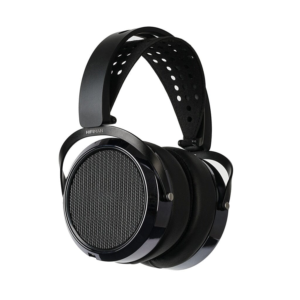 The Hifiman HE6 Remastered Headphones by Hifiman feature a wide, perforated headband and large circular ear cups with a mesh grille, providing an open-back listening experience.