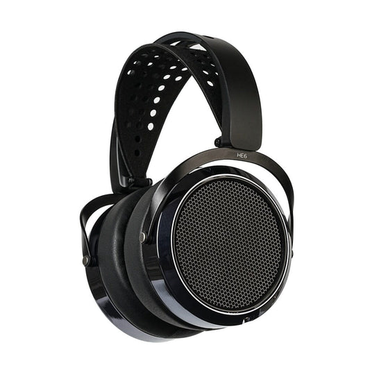 The Hifiman HE6 Remastered headphones are black, over-ear, planar magnetic headphones with a perforated headband and large round open-back ear cups with a mesh grille, shown against a white background.