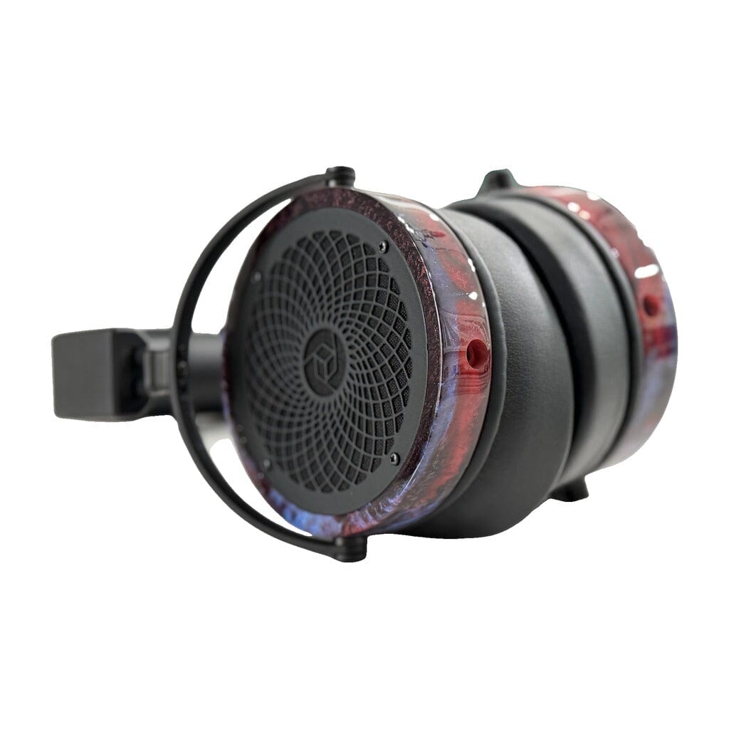 Close-up of a pair of Rosson Audio Design RAD-0 headphones, shown in open box C condition (clearance - 215), with black ear cups and headband accented by distinctive translucent, marbled red and blue sides.