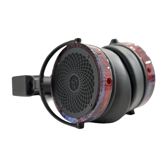 Close-up of a pair of Rosson Audio Design RAD-0 headphones, shown in open box C condition (clearance - 215), with black ear cups and headband accented by distinctive translucent, marbled red and blue sides.