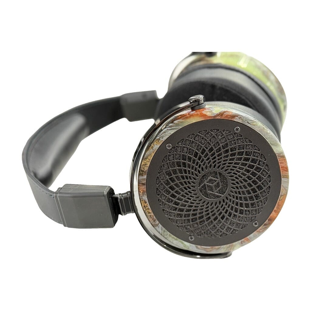 The Rosson Audio Design RAD-0 Headphones - Open Box - Clearance - 33 feature planar magnetic drivers, a patterned metal grille on the ear cups, a black headband, and vibrant marbled accents on the sides; these open-box headphones by Rosson Audio Design are displayed against a white background.