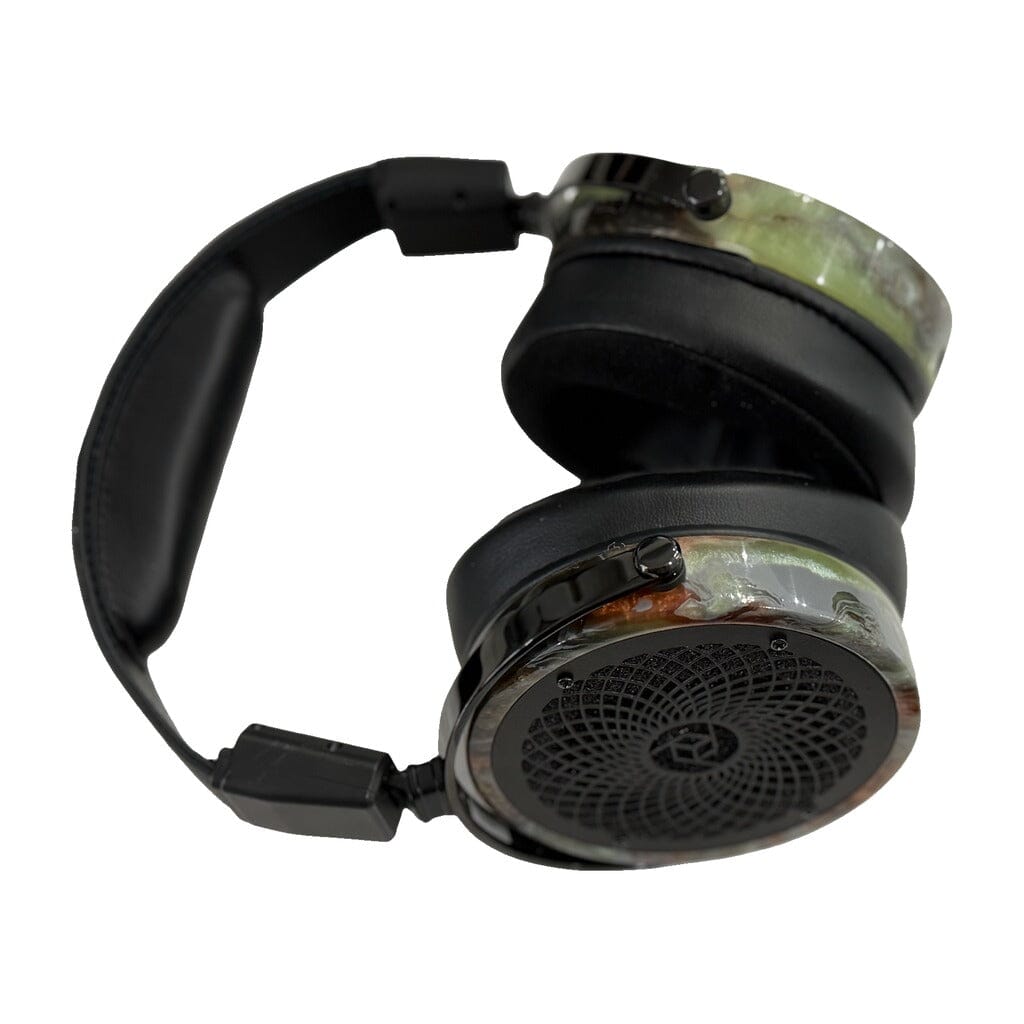 The Rosson Audio Design RAD-0 Headphones - Open Box feature a sleek black over-ear design with cushioned ear pads and headband, highlighted by a circular grill pattern on the ear cups and a distinctive marbled exterior. Utilizing planar magnetic technology, these headphones deliver an exceptional listening experience.
