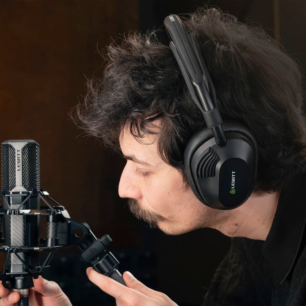 Lewitt LW6 Wireless Headphones - lifestyle, positioning a studio microphone while tracking