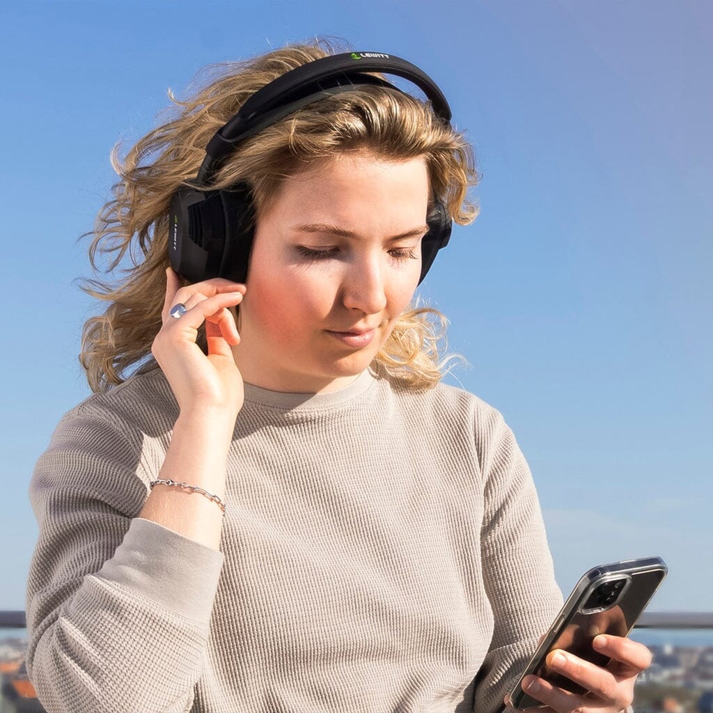 Lewitt LW6 Wireless Headphones - lifestyle, listening outdoors over Bluetooth