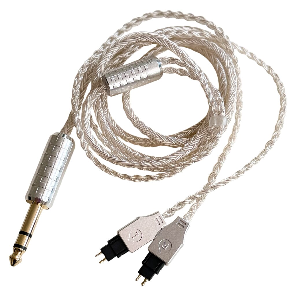 The Listenmore Etched Headphone Cable for Sennheiser HD 600 Series is a braided silver cable with a 6.35mm stereo plug and dual L/R connectors, shown coiled neatly on a white background.