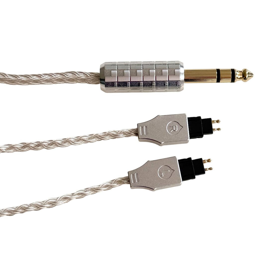 The Listenmore Etched Headphone Cable for Sennheiser HD 600 Series features a braided silver design, gold-plated 1/4" stereo plug, and etched L/R 2-pin connectors—ideal as an upgrade cable. Shown isolated on a white background.
