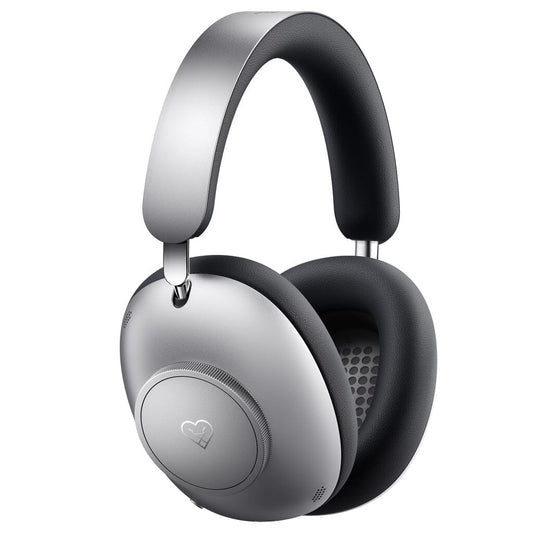 Loewe Leo Wireless Headphones by Loewe in a silver over-ear design with black cushioned ear pads, featuring a heart icon on the outer side of one ear cup and adaptive noise cancellation, displayed against a white background.