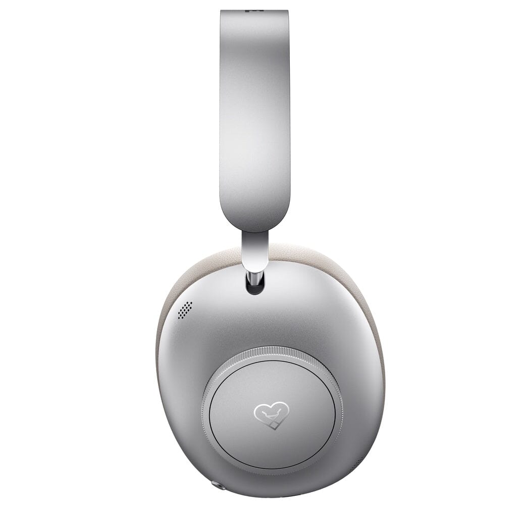 The Loewe Leo Wireless Headphones by Loewe are shown from the side in silver, featuring a smooth, modern design with a heart symbol on the ear cup. These premium wireless headphones provide personalized sound for an exceptional listening experience.
