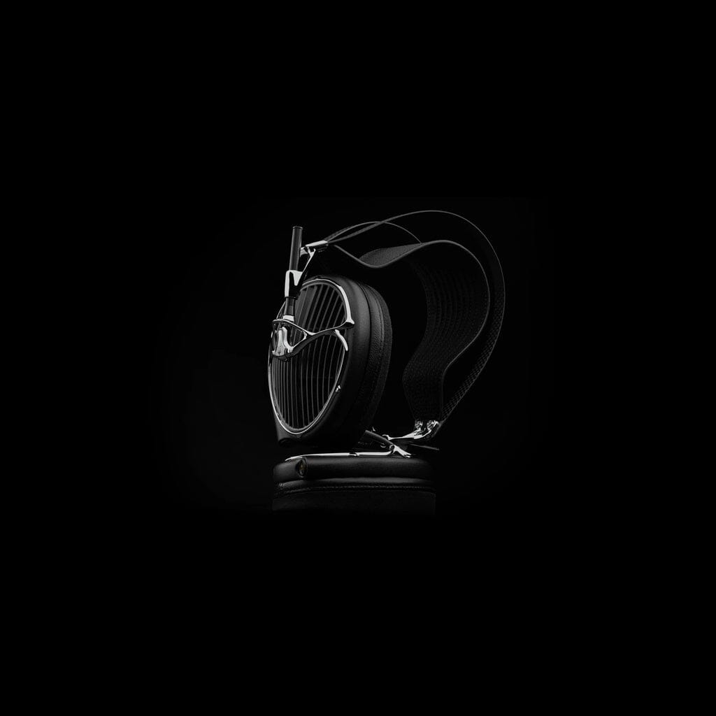 The Meze Audio ARTA Headphones by Meze, featuring a modern metallic design and high-impedance drivers, are shown in black against a dark background to emphasize their sleek, premium look.