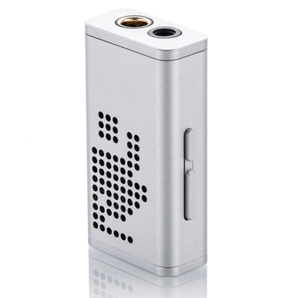 The Moondrop Dawn Pro by Moondrop is a compact, silver, rectangular device featuring dual circular top ports, patterned front vents, and a side sliding switch—perfect as a portable headphone amplifier for HiFi playback.