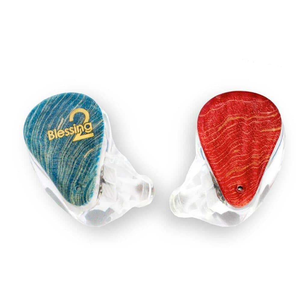The Moondrop Blessing 2 In-Ear Headphones (Open Box) feature transparent shells with a blue wooden faceplate and gold lettering on the left, red on the right—premium hybrid driver earphones by Moondrop for discerning listeners.
