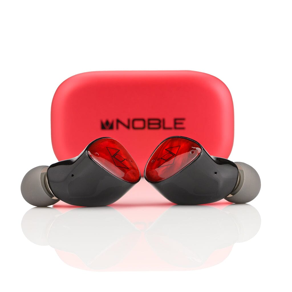 Two black and red Noble Audio FoKus Amadeus True Wireless In-Ear Headphones with dynamic drivers are placed before a bright red charging case with NOBLE and its logo in black, set against a white background.