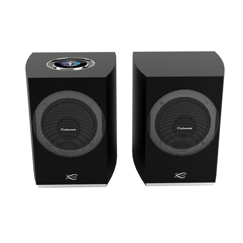 The Cabasse Rialto Wireless Powered Bookshelf Speaker Pair features black rectangular cabinets with circular mesh grilles and a logo at the bottom; the left speaker adds a circular control panel on top for hi-fi sound.