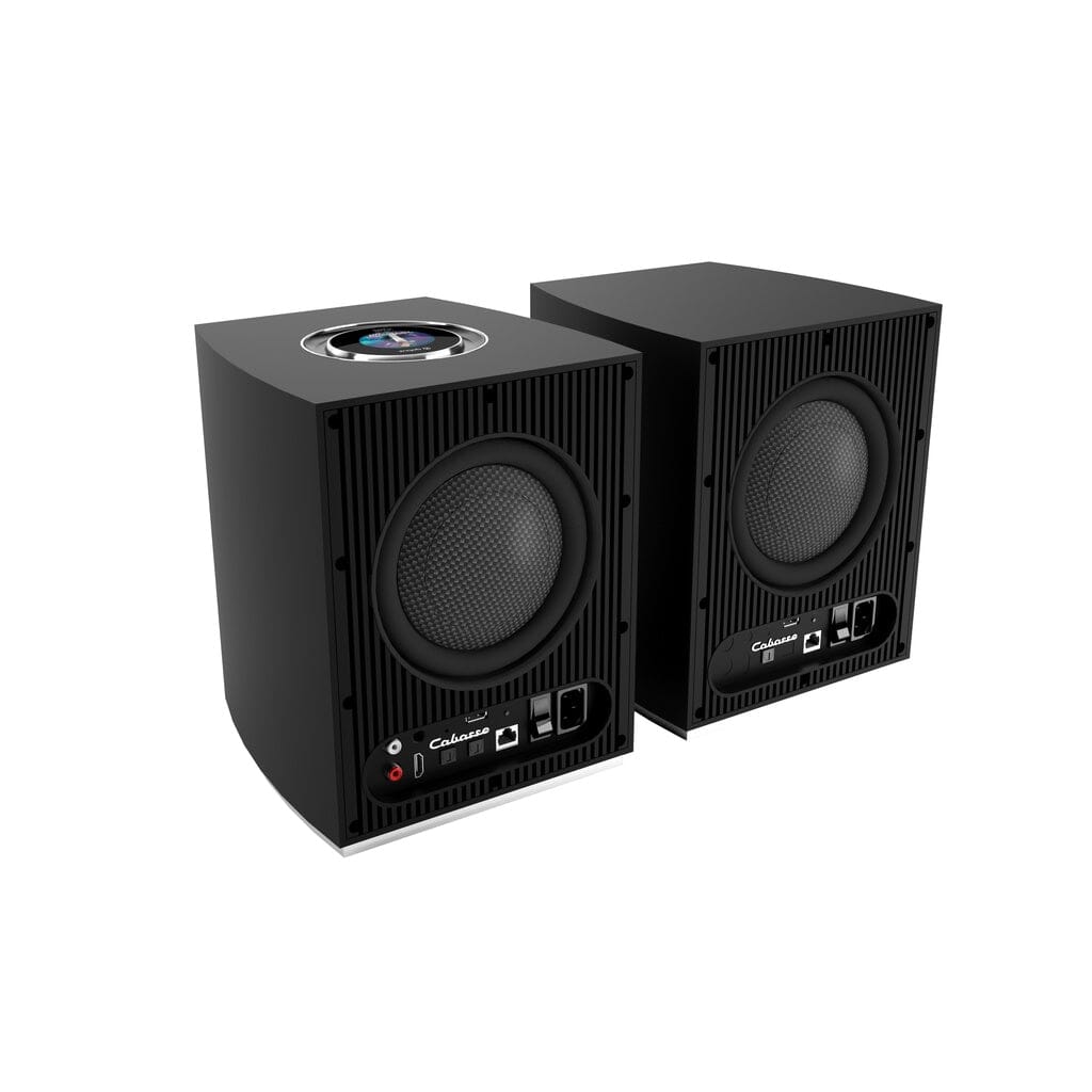 The Cabasse Rialto Wireless Powered Bookshelf Speaker pair by Cabasse features two black rectangular speakers with front grilles, top-mounted circular drivers, and visible controls and ports, delivering high-fidelity sound on a white background.