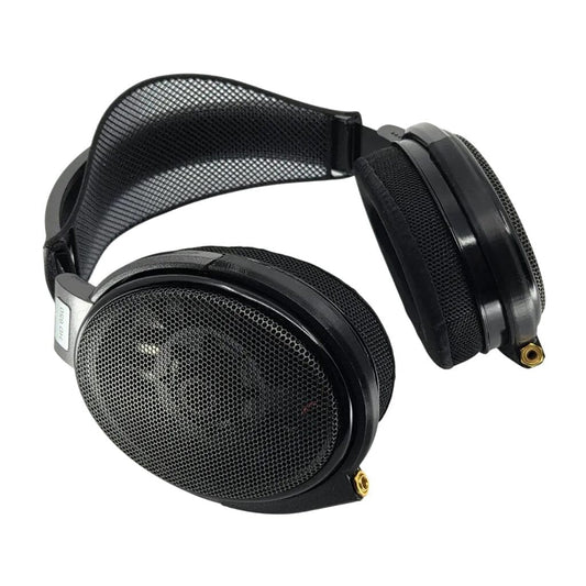 The Capra Audio Comfort Strap for Sennheiser HD 600 Series Headphones is shown on a pair of black over-ear headphones with large oval ear cups and a padded mesh headband against a white background.