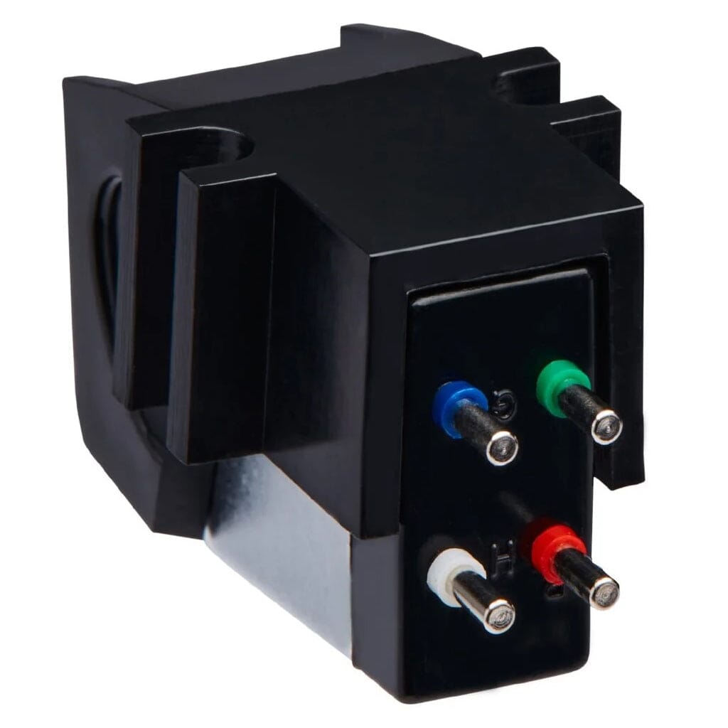 A close-up of the Sumiko Black Pearl Phono Cartridge - Clearance by Sumiko, showing its four color-coded pins (blue, green, white, red) for connecting to a turntable tonearm.