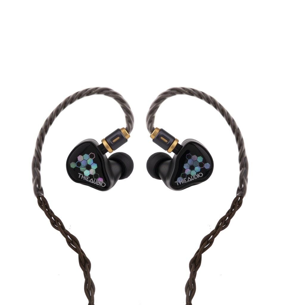 A pair of black Thieaudio Monarch MKIV in-ear headphones with braided cables in a heart shape. The earbuds feature a colorful hexagonal Thieaudio logo, inspired by the Monarch MKIV’s adjustable tuning switch design.
