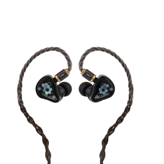 A pair of black Thieaudio Monarch MKIV in-ear headphones with braided cables in a heart shape. The earbuds feature a colorful hexagonal Thieaudio logo, inspired by the Monarch MKIV’s adjustable tuning switch design.