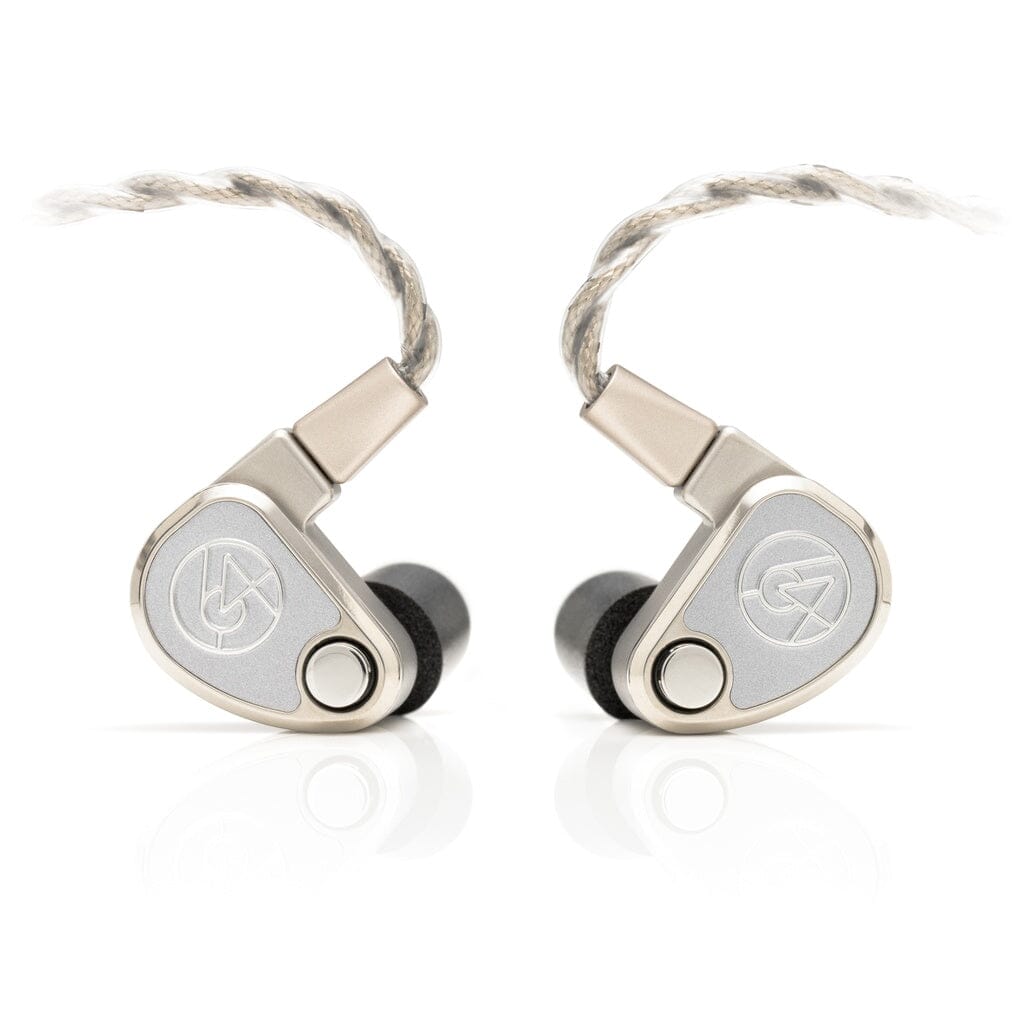 A pair of 64 Audio TWELVE Ti silver titanium in-ear headphones with a triangular shape, braided cables, and black ear tips are placed side by side on a white background.