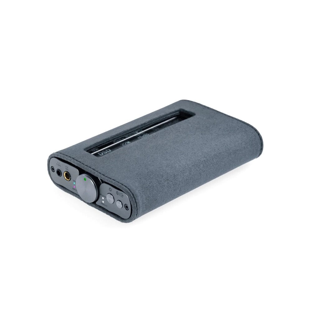 A compact gray iFi Audio xDSD Gryphon features a cylindrical volume knob, multiple buttons, ports, and a top window showing internal parts—resting on white and perfectly protected by the iFi Audio xDSD Gryphon Protective Case - Clearance.