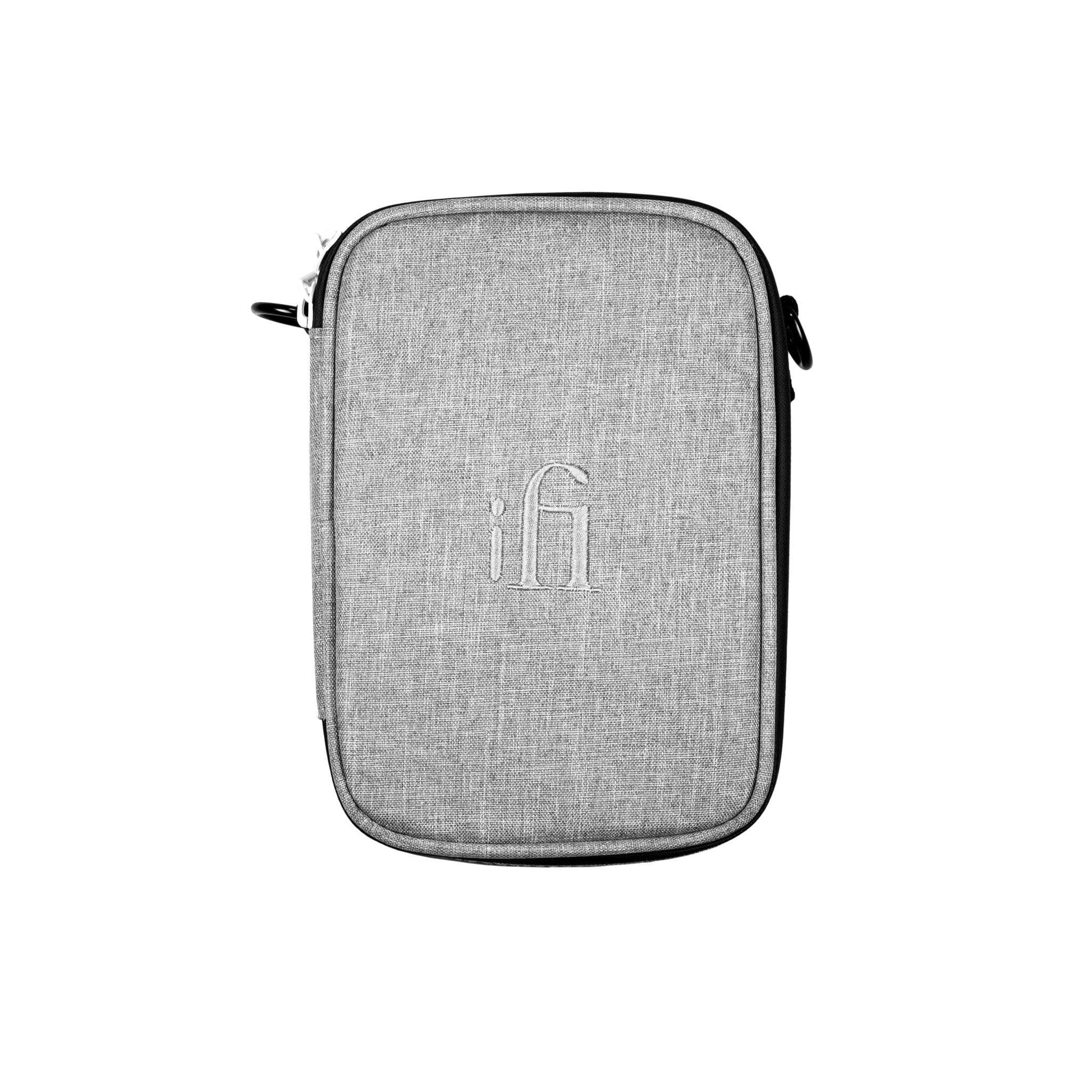 The iFi Audio iTraveller Carry Case by iFi Audio is a light gray rectangular fabric case with a zipper and subtle embroidered logo, ideal for carrying portable DACs and accessories. Photographed on a white background. Clearance item.